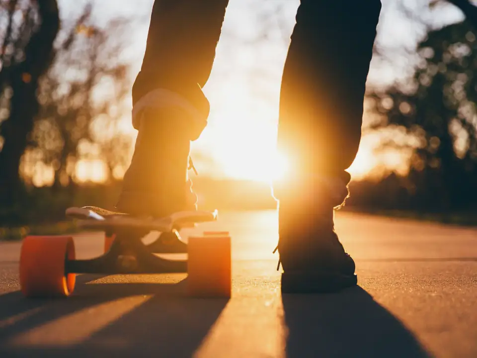 Close view of a skateboard and truck assembly in use