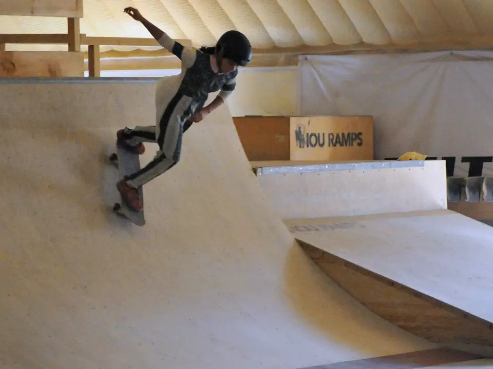 Skateboarder dropping into a ramp