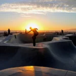 Skateboarder riding a bowl at Venice Beach skatepark